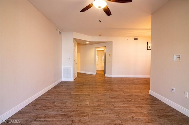 empty room featuring hardwood / wood-style floors and ceiling fan