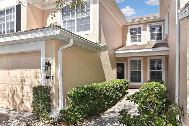 entrance to property featuring a garage