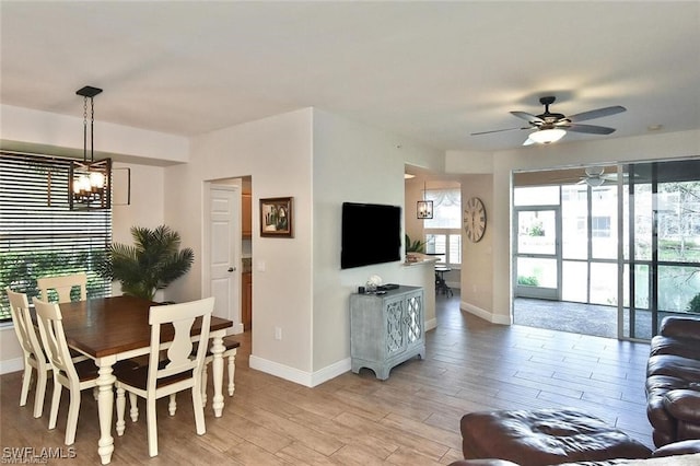 dining room featuring ceiling fan and light hardwood / wood-style floors