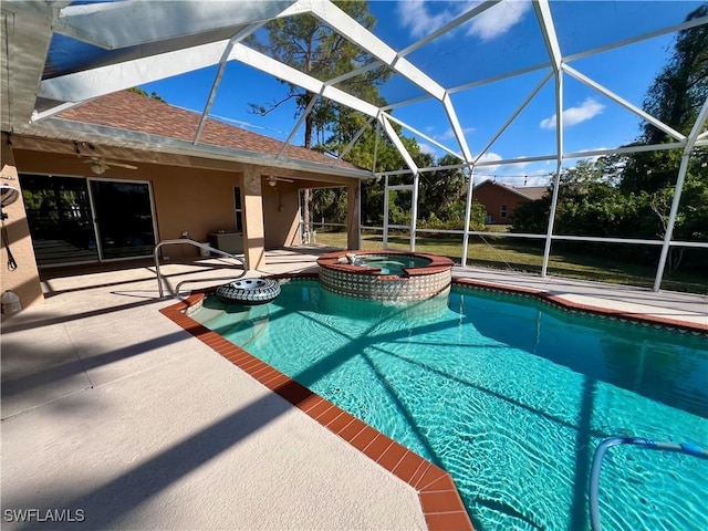 view of pool with glass enclosure, an in ground hot tub, a patio area, and ceiling fan