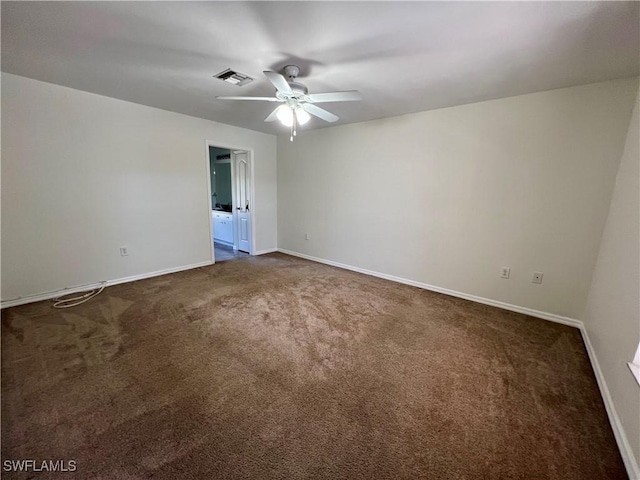 carpeted spare room featuring ceiling fan