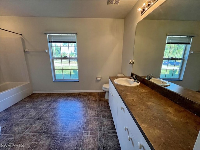 full bathroom featuring toilet, shower / bathing tub combination, and vanity