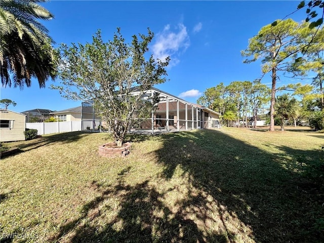 view of yard with a lanai