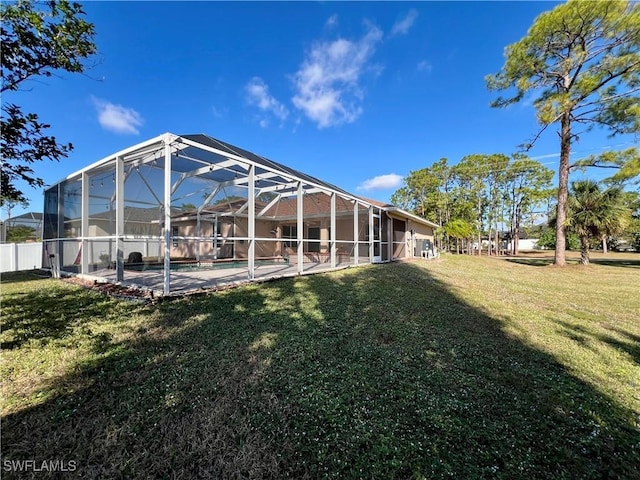 view of yard with a patio and a lanai