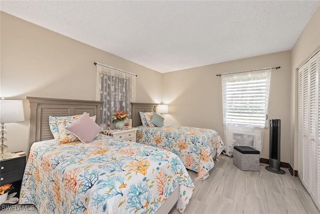 bedroom with a closet and a textured ceiling