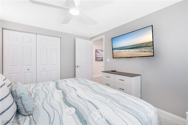 bedroom featuring ceiling fan and a closet