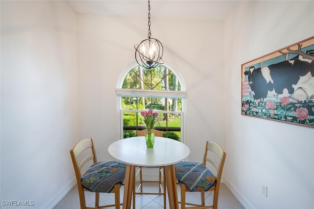 dining area with an inviting chandelier