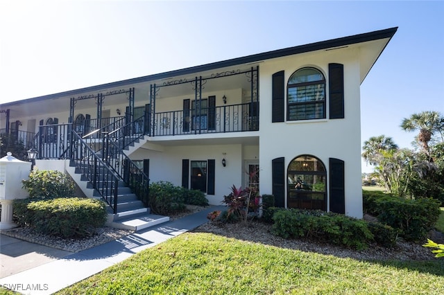 view of front of home with a balcony