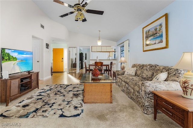 carpeted living room featuring high vaulted ceiling and ceiling fan