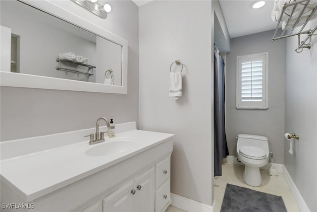 bathroom with vanity and toilet