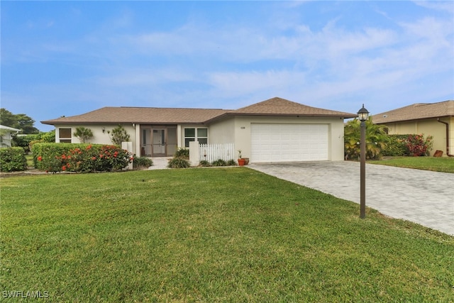 single story home featuring a garage and a front yard