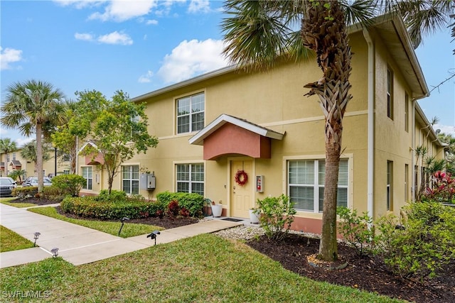 view of front of home with a front yard