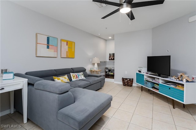 tiled living room with ceiling fan