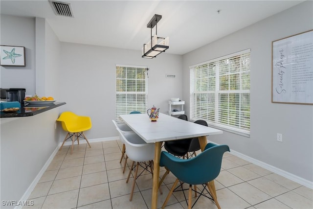 dining space with light tile patterned floors