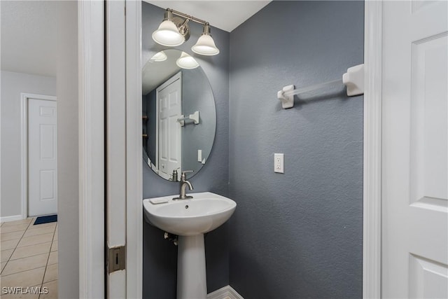 bathroom with tile patterned floors