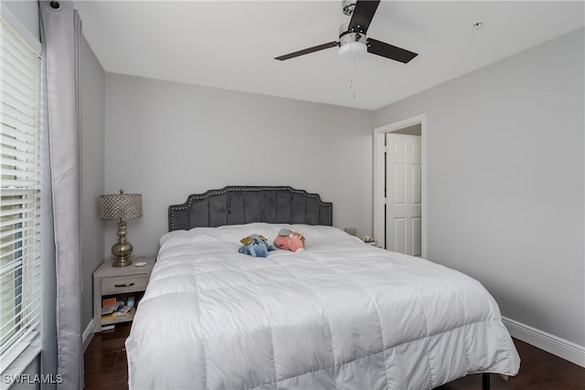 bedroom featuring dark wood-type flooring and ceiling fan