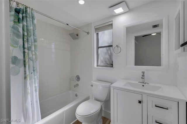 full bathroom featuring vanity, toilet, and shower / bath combo with shower curtain