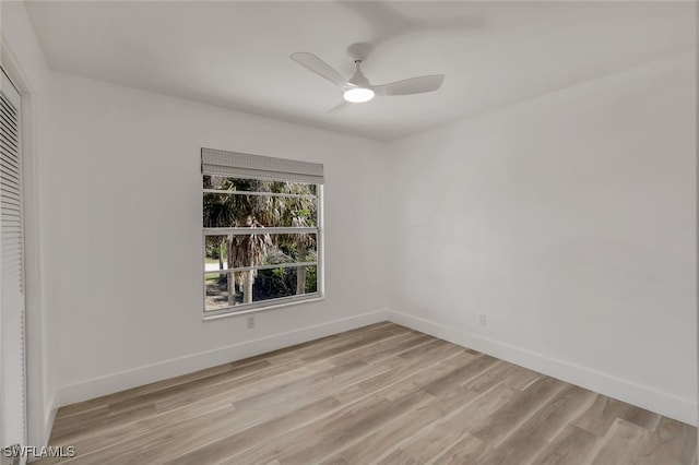 unfurnished room featuring light hardwood / wood-style flooring and ceiling fan