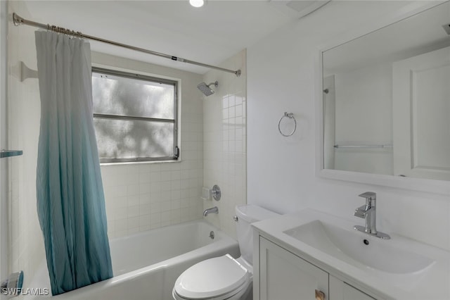 full bathroom featuring toilet, vanity, and shower / tub combo with curtain