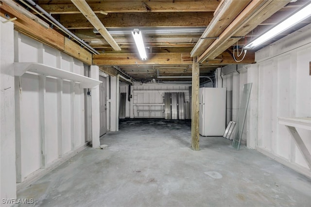 basement with white fridge