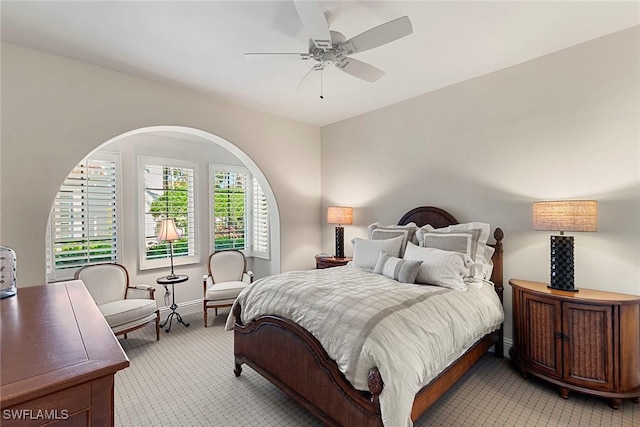 bedroom with baseboards and a ceiling fan