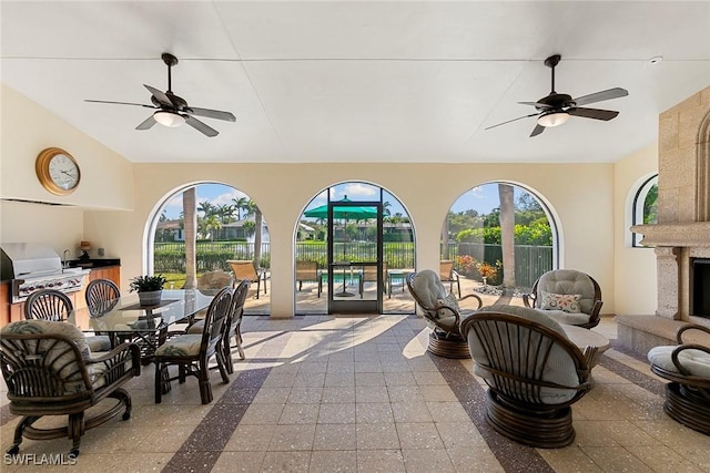 view of patio / terrace with ceiling fan, a grill, outdoor dining area, and area for grilling