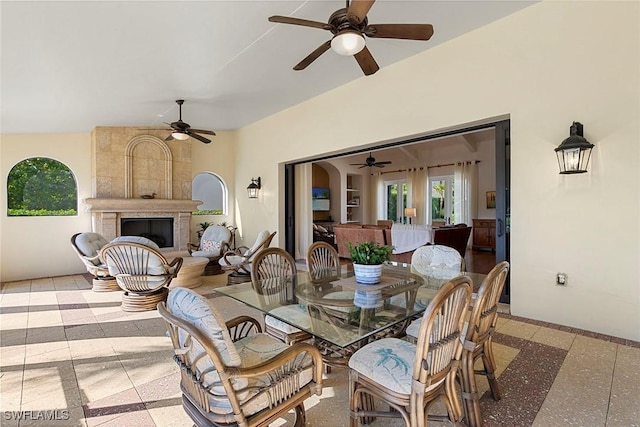 dining space featuring a fireplace