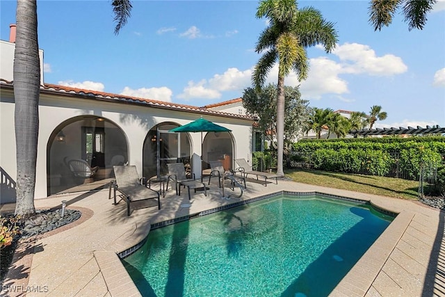 view of pool with a fenced in pool, a patio area, and fence