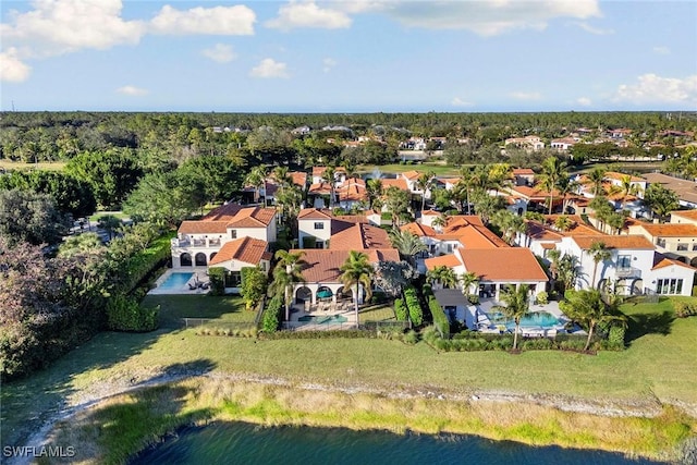 bird's eye view with a residential view and a water view