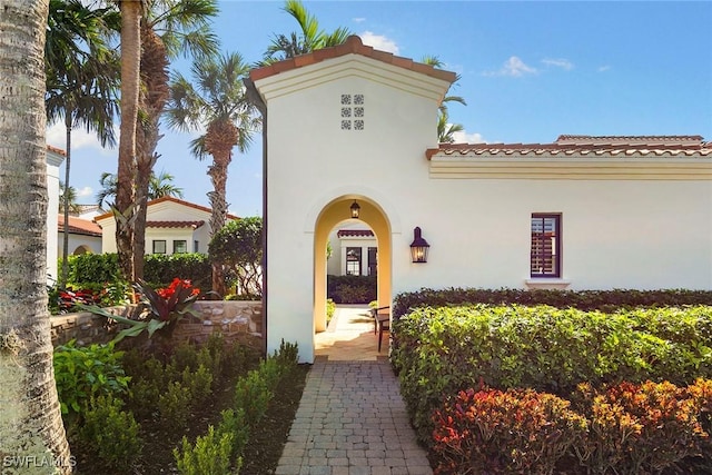 property entrance with stucco siding