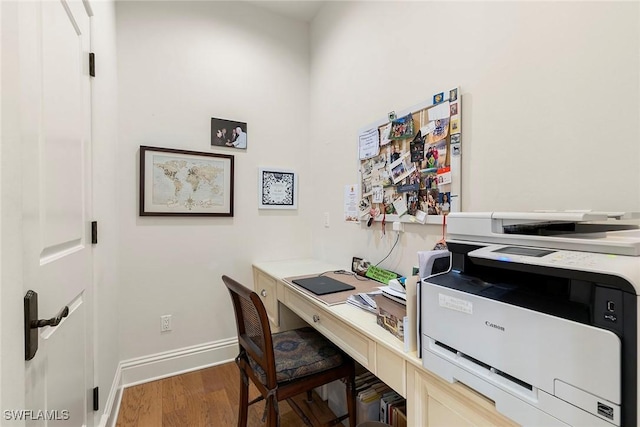 office space featuring dark wood-style floors and baseboards