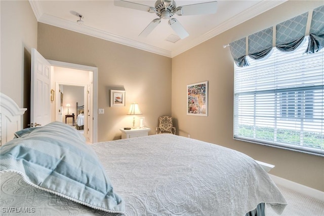 carpeted bedroom featuring crown molding and ceiling fan