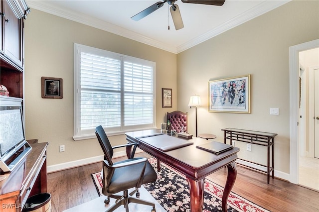 office space with crown molding, dark hardwood / wood-style floors, and ceiling fan