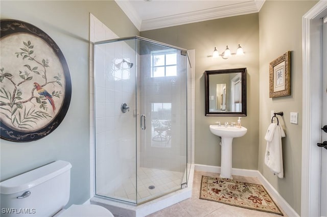 bathroom with walk in shower, tile patterned floors, ornamental molding, and toilet