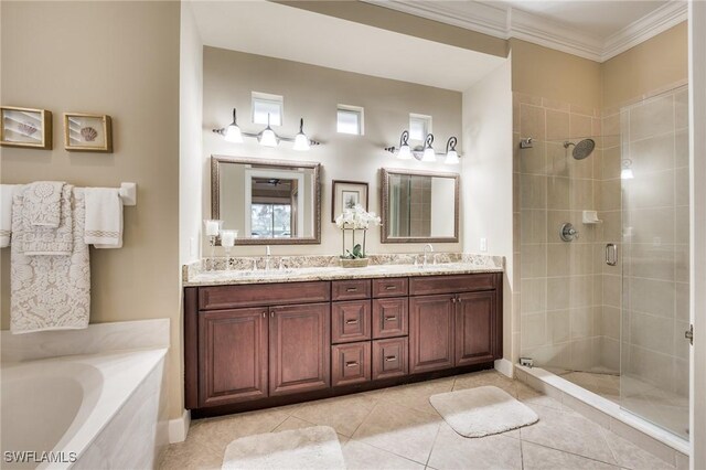 bathroom with vanity, crown molding, tile patterned floors, and separate shower and tub