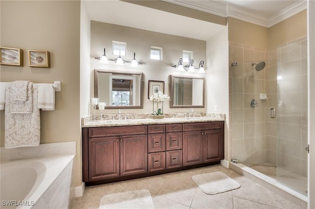 bathroom featuring vanity, tile patterned flooring, crown molding, and shower with separate bathtub