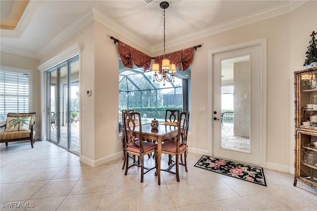 tiled dining space with crown molding, a wealth of natural light, and a notable chandelier