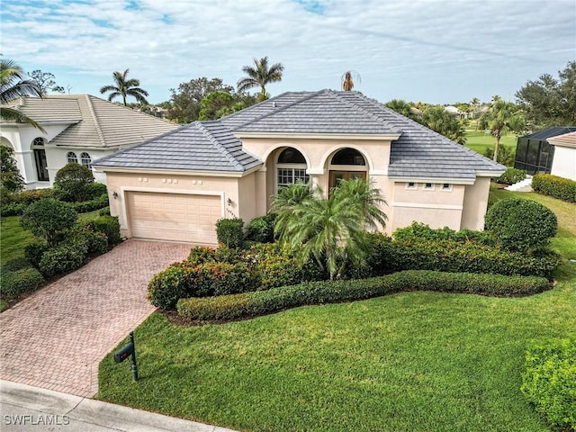 view of front of home featuring a garage and a front yard