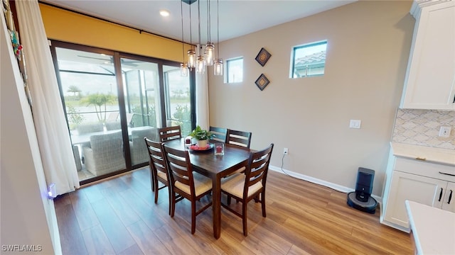 dining room featuring an inviting chandelier and light wood-type flooring