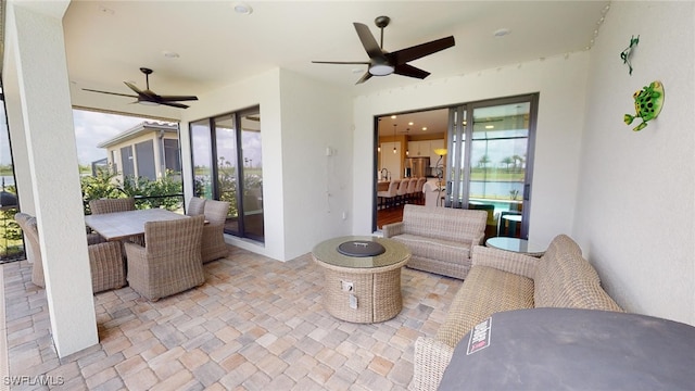 view of patio / terrace featuring ceiling fan and outdoor lounge area