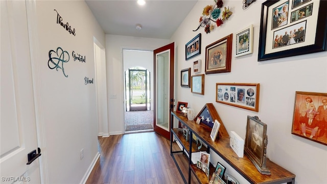 hallway with dark hardwood / wood-style floors