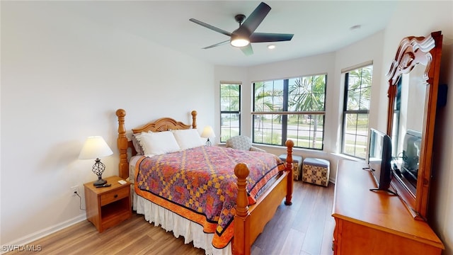 bedroom featuring wood-type flooring and ceiling fan