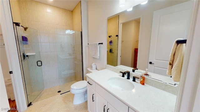 bathroom with vanity, an enclosed shower, tile patterned floors, and toilet