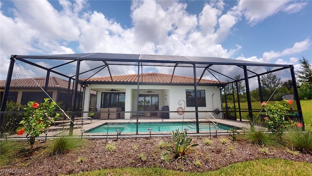 back of property featuring a lanai, a patio, and ceiling fan