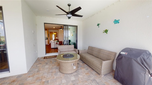 view of patio / terrace featuring ceiling fan, area for grilling, and outdoor lounge area