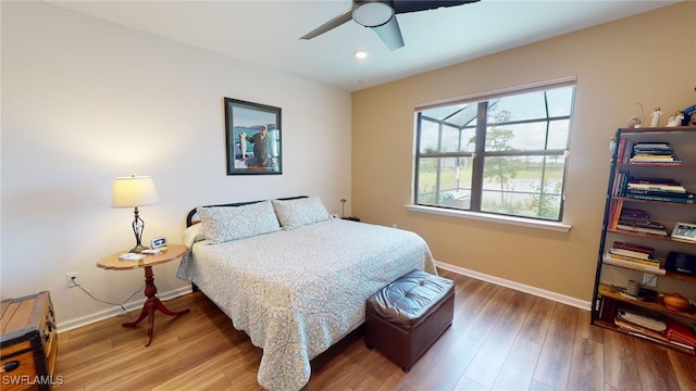 bedroom featuring hardwood / wood-style floors and ceiling fan