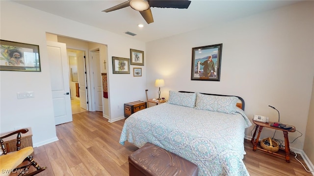 bedroom featuring ceiling fan and light hardwood / wood-style flooring