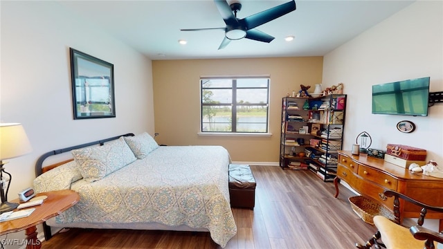 bedroom featuring ceiling fan and wood-type flooring