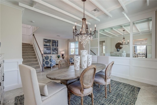 dining area with plenty of natural light, a chandelier, beam ceiling, and light tile patterned floors