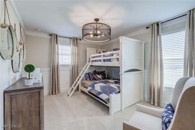 bedroom featuring light colored carpet and crown molding